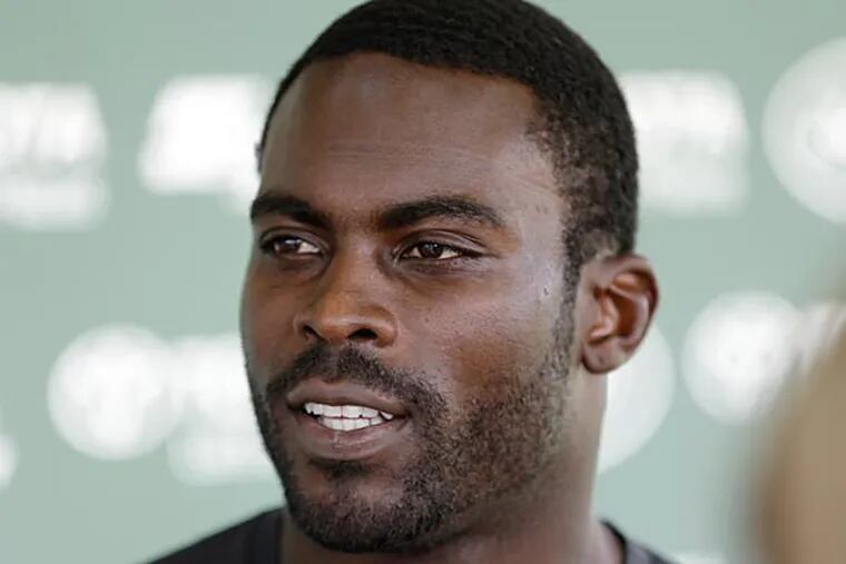 Jets quarterback Michael Vick responds to questions after during a news interview after practice during NFL football training camp Saturday, July 26, 2014, in Cortland, N.Y. (AP Photo)