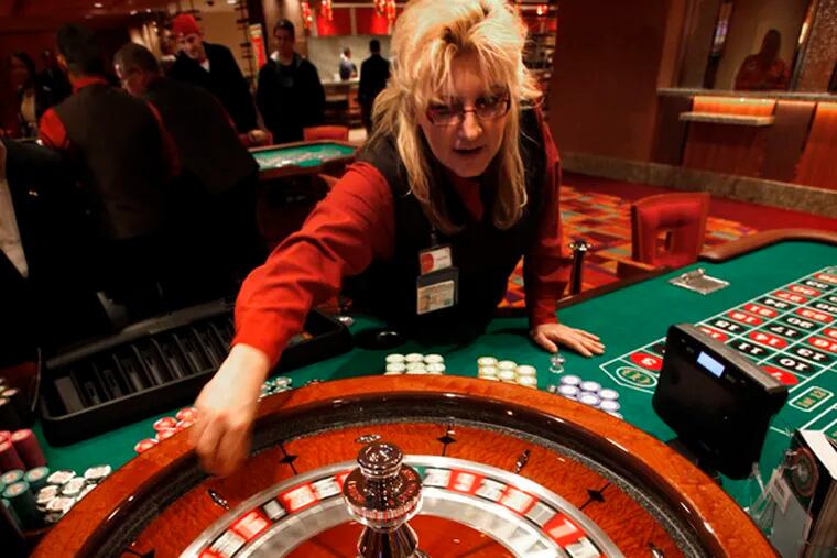Laureen Jolley spins the roulette wheel in the new Parx East Casino in the old Philly Park building on opening day, December 22. 2010.  (Laurence Kesterson / Staff Photographer)  EDITORS NOTE:  PARX23, 12/22/10, Bensalem, Pa.  The second half of Parx Casino - Parx East - officially opens today (WED -12/22) at 10am with new live table games such as pai-gow, pai-gow tiles, mini-baccarat, geared toward the Asian clientele, as well as 3 card poker, 4 card poker, blackjack, roulette and craps tables. A new dining outlet - The Noodle Bar - also debuts today. This latest expansion adds to last month's launch of a new poker room on the third floor and has created approximately 400 new jobs at the state's top grossing casino.