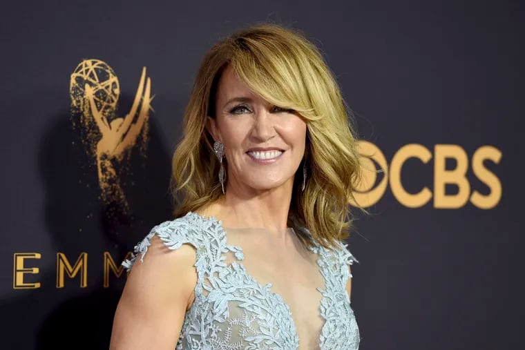 Actress Felicity Huffman at the 69th Primetime Emmy Awards in Los Angeles. She and actress Lori Loughlin were charged with fraud and conspiracy Tuesday along with dozens of others in a scheme that according to federal prosecutors saw wealthy parents pay bribes to get their children into some of the nation's top colleges.