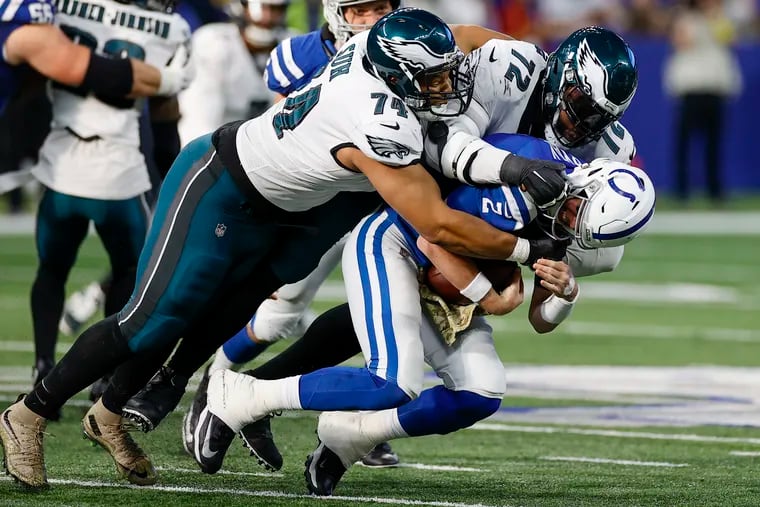 Eagles defensive tackles Ndamukong Suh (74) and Linval Joseph sack Colts quarterback Matt Ryan.