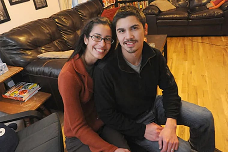 Kathryn and Randy Ribay in their Fairview home. Kathryn Ribay &quot;fell in love with the city&quot; in 2006 while working for Teach for America, where she met her husband. (April Saul/Staff)