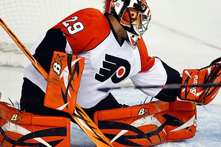 Ray Emery only had to make 13 saves in the Flyers' shutout of Calgary. (Jeff McIntosh/Canadian Press/AP)