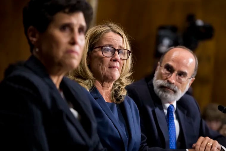 Christine Blasey Ford testifies during the Senate Judiciary Committee hearing, Thursday with her attorneys Debra Katz and Michael Bromwich.