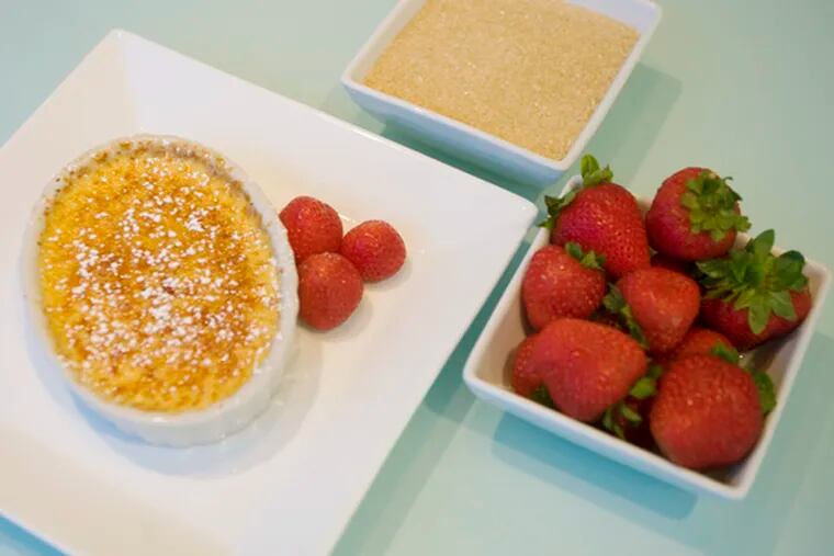 Pippo Lamberti&#0039;s Creme Brulee with a side of berries.