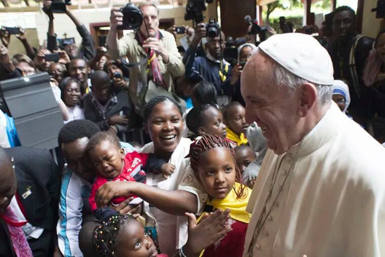 In Kenya's Kangemi shantytown , children reach out to Pope Francis. The pontiff denounced conditions, saying access to safe water is a right. L'Osservatore Romano, Pool via AP