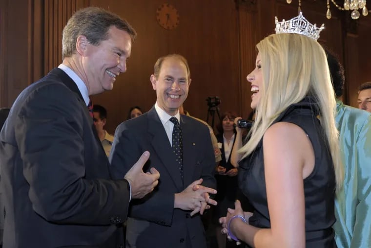 Prince Edward, center, shares a laugh with Sam Haskell, left, and Miss America 2011 Teresa Scanlan, right, during a reception on Capitol Hill in Washington, Monday, June 20, 2011. (AP Photo/Susan Walsh)