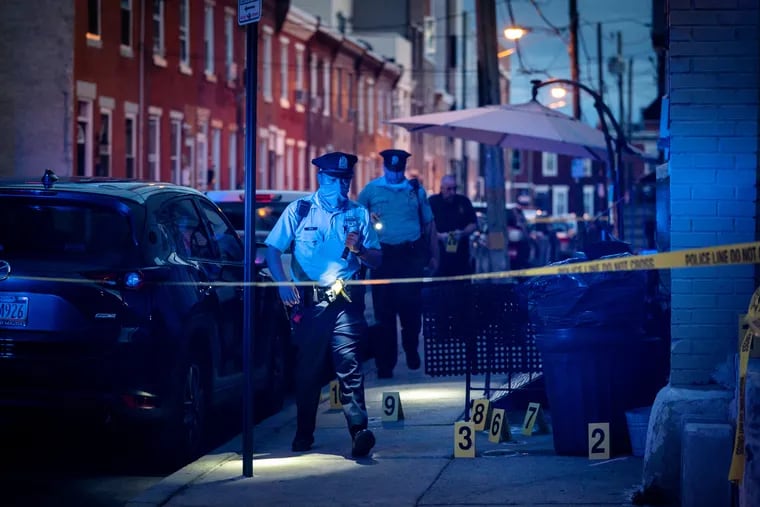 Philadelphia police investigate a double shooting on the 1500 South Cleveland St., in Philadelphia, Friday, September 3, 2021. Gun violence spiked in 2020 and 2021, contributing to Philadelphia recording more homicides this year than ever before.