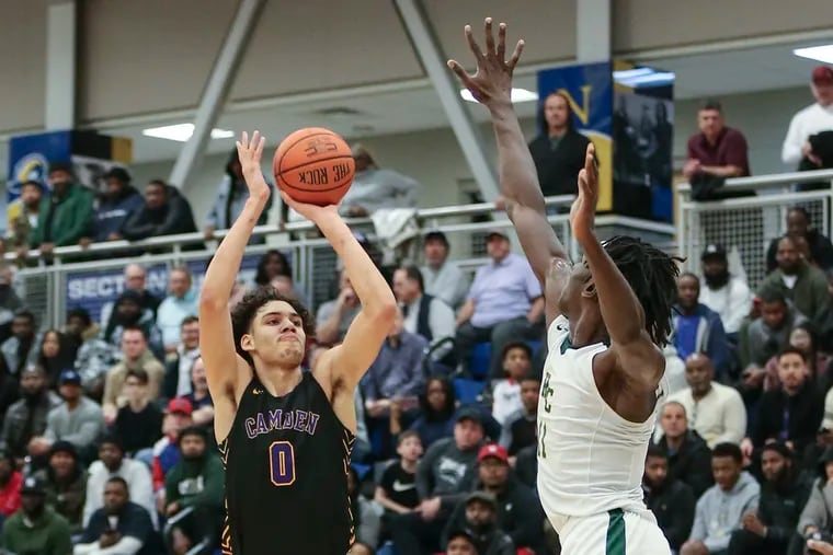 Camden's Lance Ware shoots over Roselle Catholic's Cliff Omoyuri during the Panthers' 63-51 victory on Thursday night.
