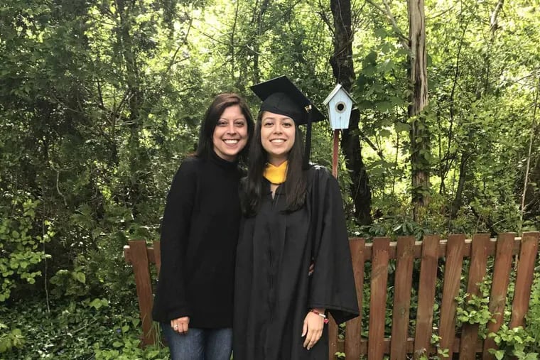 Columnist Helen Ubiñas poses with her niece after her graduation from Sacred Heart University.