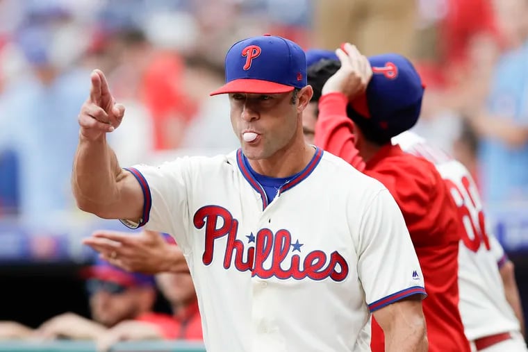Phillies manager Gabe Kapler points toward the Marlins dugout before the season finale.