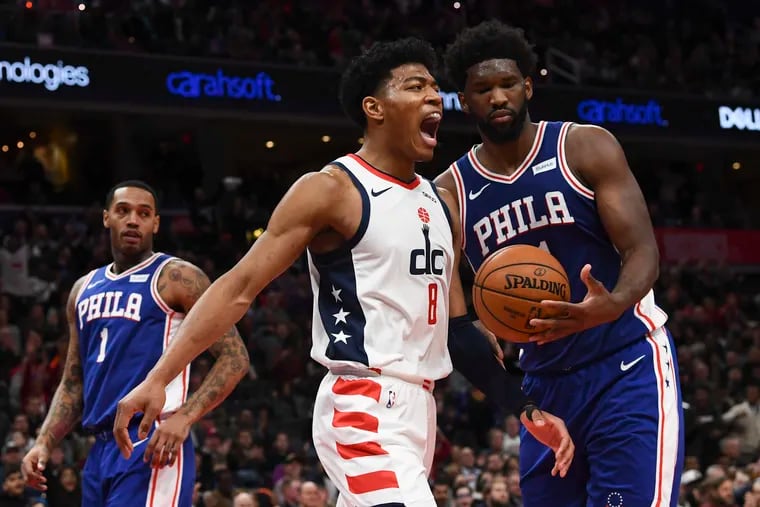 Joel Embiid (right), Mike Scott (1), and the 76ers have a disappointing 5-7 road record this season. They have lost seven of their last nine road games.