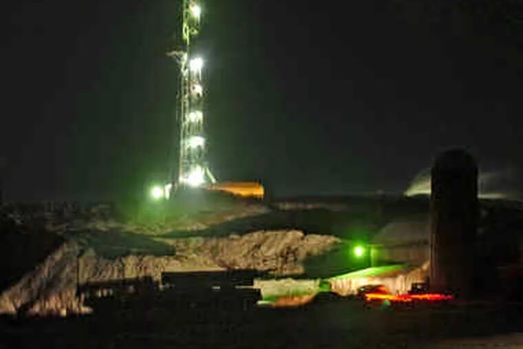 From the center of Dimock, Pa., a natural gas drill rig lit up at night looks like a rocket launchpad. While it has stirred local anger, a Texas drilling firm has also given landowners hopes of making millions of dollars in gas royalties.