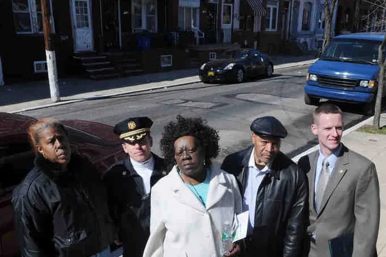 Working together in Hartranft as part of PhillyRising are (from left) Arnetta Curry, 26th District Capt. Mike Cram, Diane Bridges, Jesse Crosby and City Deputy Managing Director John Farrell. SARAH J. GLOVER / Staff photographer