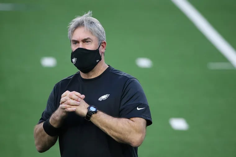 Eagles head coach Doug Pederson during warmups prior to Sunday's 37-17 loss to Dallas. He said on Monday that he wants to be a part of the solution in getting the team back to its 2017 form.