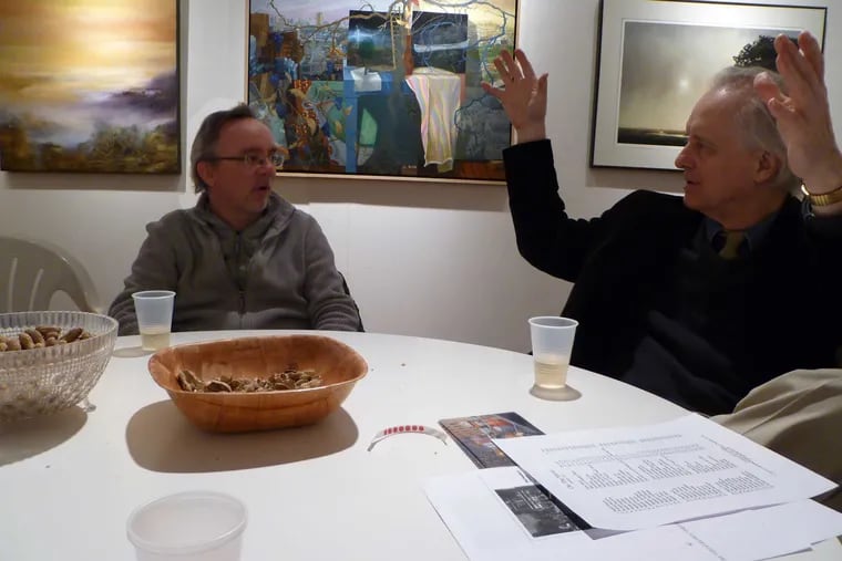 Rodger LaPelle (on the right) makes a point in conversation with artist Joe Naujokas at the LaPelle Gallery.