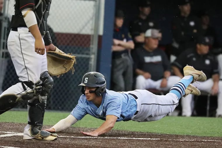 Connor Coolahan slides across home plate with the eventual winning run in Shawnee's 2-0 victory over Haddonfield in the Diamond Classic title game.