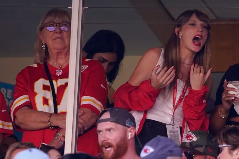 Taylor Swift (right) watches from a suite alongside Travis Kelce's mother, Donna Kelce, inside Arrowhead Stadium during the first half of an NFL football game between the Chicago Bears and Kansas City Chiefs Sept. 24.
