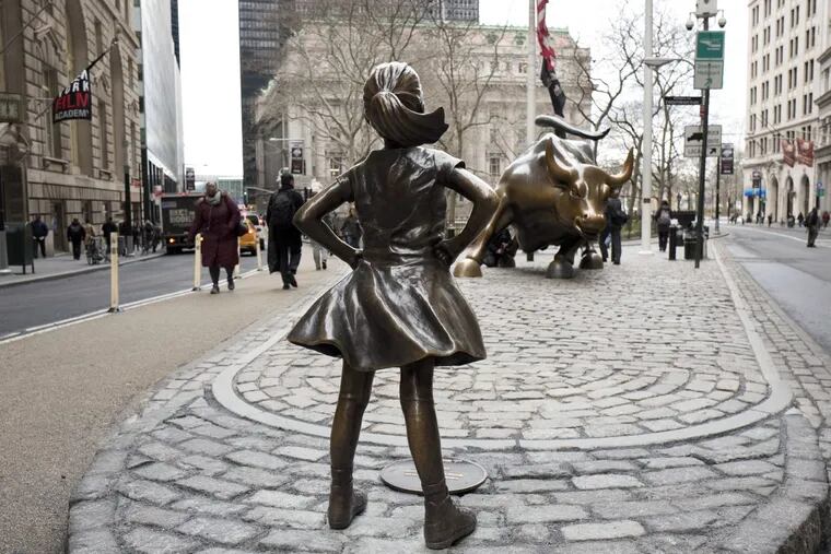 The “Fearless Girl” faces Wall Street’s charging bull in Manhattan earlier this year.