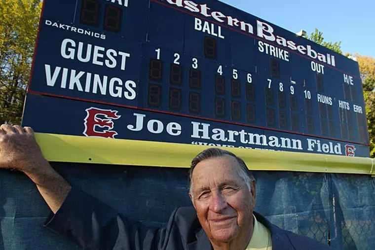 Joe Hartmann stands in front of the scoreboard at Eastern High School. The Joe Hartman Diamond Classic celebrates its 40 year this season (Ron Cortes/Staff Photographer)