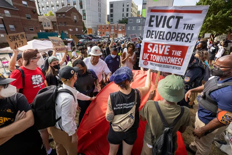 A protest over the sale of the University City Townhomes at 40th and Market Streets in August shows the tension that has arisen over redevelopment in the neighborhood.