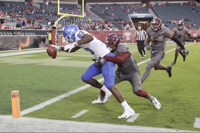 Buffalo wide receiver Anthony Johnson scores the game winning fourth-quarter touchdown against Temple safety Delvon Randall on Saturday, September 8, 2018. YONG KIM / Staff Photographer