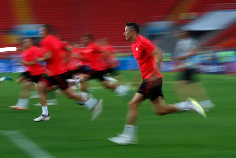 Poland's Robert Lewandowski runs during Poland's official training on the eve of the group H match between Poland and Senegal at the 2018 soccer World Cup in the Spartak Stadium in Moscow, Russia, Monday, June 18, 2018.