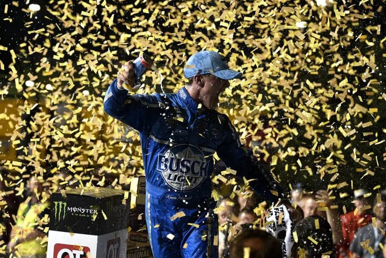 Kevin Harvick celebrates after winning the NASCAR Cup Series auto race at Kansas Speedway on Saturday, May 12, 2018, in Kansas City, Kan.