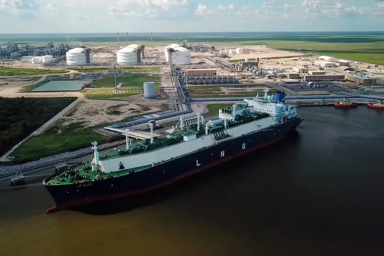 In this July 6, 2018 photo, a carrier ship for liquefied natural gas (LNG) is docked at Cheniere’s Sabine Pass Terminal in Cameron Parish, La. By specifically promoting LNG exports, the U.S. government is helping guarantee the success of a handful of companies _ using taxpayer dollars to boost a nascent industry it also regulates. Houston-based Cheniere has benefited from the government’s LNG push. (Kevin Clancy/Newsy via AP)