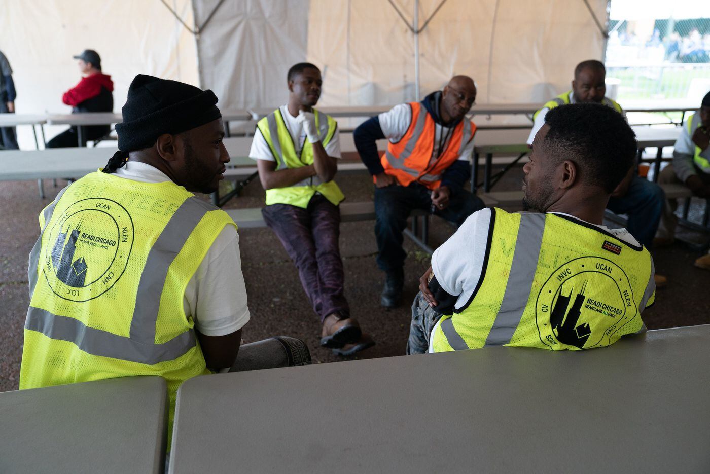 Participants of the READI Chicago, a gun violence program for high risk men, and their crew chief participating in cognitive behavioral therapy prior to the 2019 Chicago Special Olympics, which participants have worked at for the past two years.