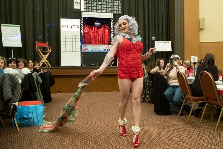 For the last 10 years, AIDS Fund associate director Tim Johnson has served as a Bingo Verifying Diva at the fund's monthly GayBINGO nights. As drag queen Stella D'Oro, Johnson entertains guests and verifies bingo cards along with other drag queens. Here, Stella is shown singing "Anything Goes" to players during "Love Boat GayBINGO" last month.