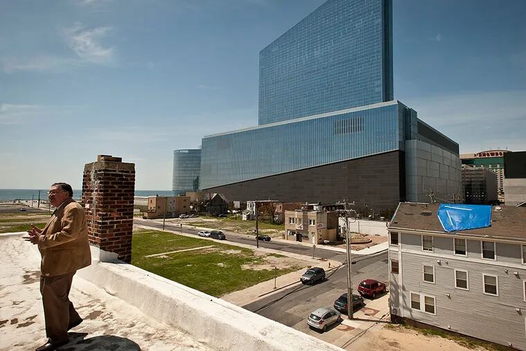 Charlie Birnbaum stands on the roof of his parents home at  311 Oriental Avenue in Atlantic City, overlooking the Revel casino. Revel is now known as the Ocean Resort Casino.