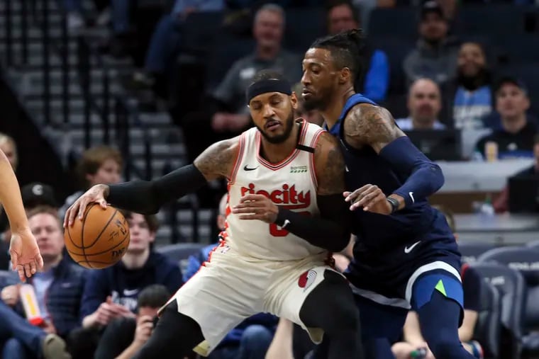 Minnesota Timberwolves forward Robert Covington (right) defends against Portland's Carmelo Anthony. He is is one of the NBA's best three-and-D players.
