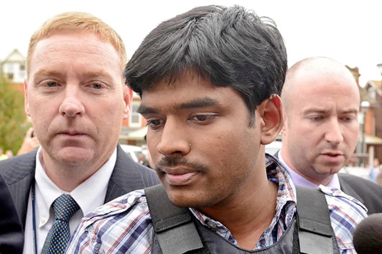In body armor, Raghunandan Yandamuri is taken into a preliminary hearing. The King of Prussia man, on trial in the 2012 murders of a baby and grandmother, told a Montgomery County jury on Monday that he confessed to the killings because the police had threatened him and his wife.