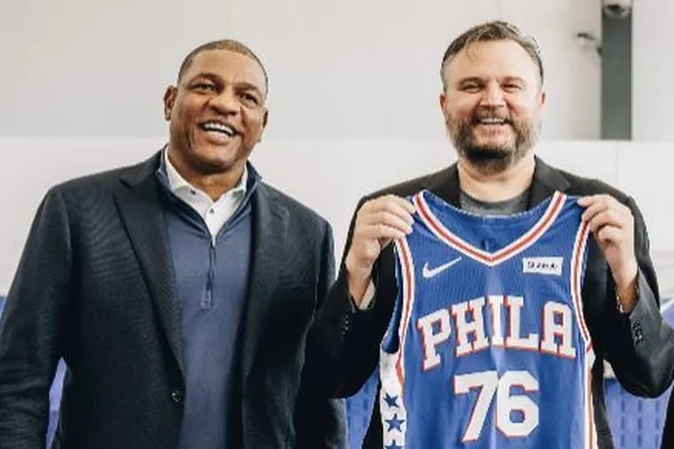 Daryl Morey, standing with Doc Rivers (left), cleaned up the mess created by the 76ers front office last summer.