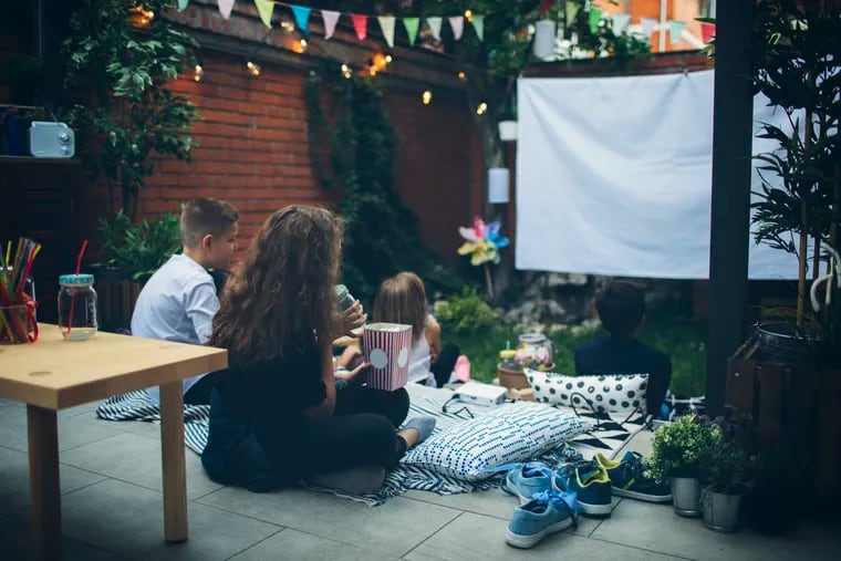 Backyard movie nights are what we need this summer.