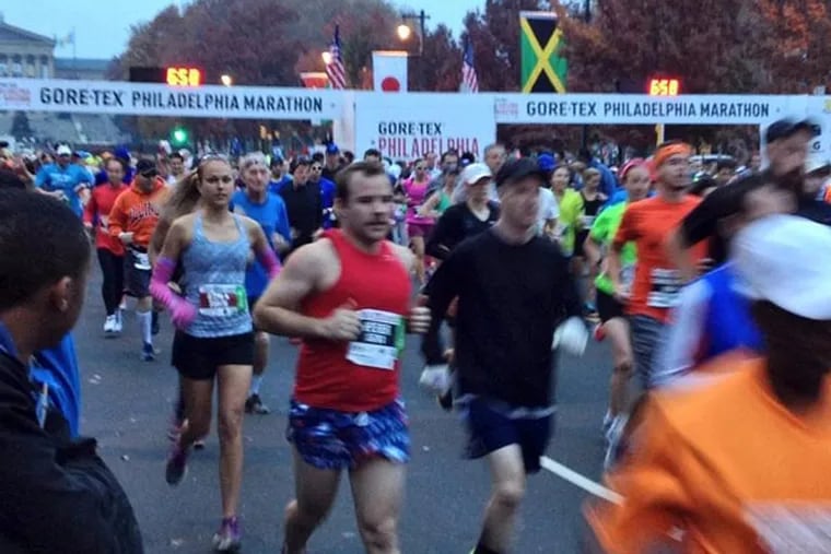 The first runners take off at the 2013 Philadelphia Marathon on Sunday, Nov. 17.