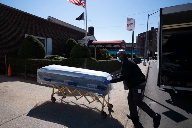 William Samuels delivers caskets to the Gerard Neufeld Funeral Home during in the Queens borough of New York last March.