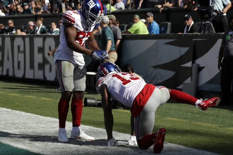 New York Giants' Odell Beckham, right, celebrates with Sterling Shepard after a touchdown during the second half of an NFL football game against the Philadelphia Eagles, Sunday, Sept. 24, 2017, in Philadelphia.