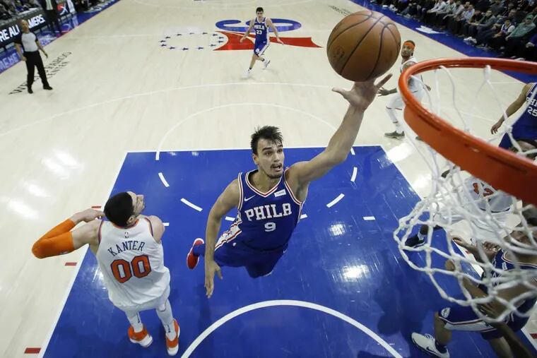 Sixers’ forward Dario Saric goes up for a shot past Knicks big man Enes Kanter during the Sixers’ win on Wednesday.