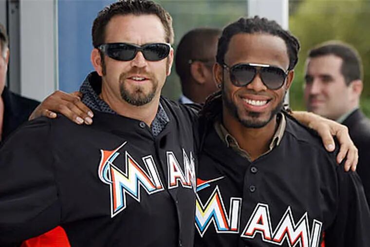 Jose Reyes (right) was one of the Miami Marlins' marquee offseason signings. (AP file photo)