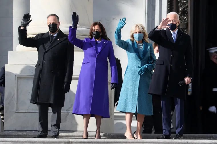 From left, Doug Emhoff, U.S. Vice President-elect Kamala Harris, Jill Biden and President-elect Joe Biden wave as they arrive on the East Front of the U.S. Capitol for the inauguration.