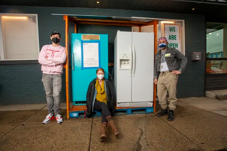 From left are community organizers of the Coral Street Fridge: Matt Stebbins, Kaelee Shepherd, and Anthony Perez. The refrigerators are located outside the Kensington Community Food Co-op at corner of Lehigh Avenue and Coral St.