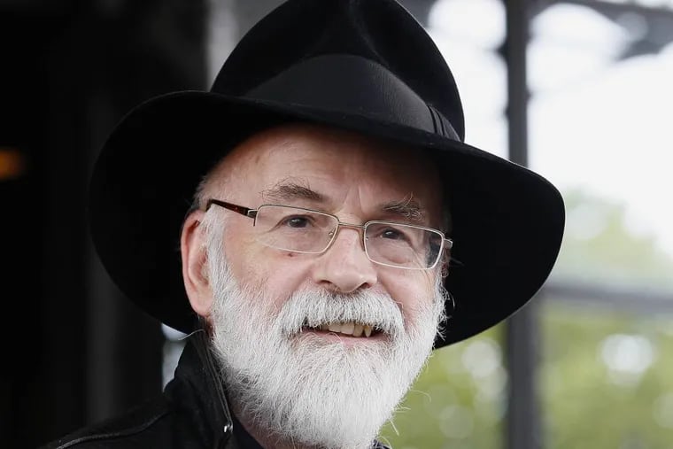 FILE - This is a Tuesday, Oct. 5, 2010   file photo of British author Terry Pratchett  seen at the Conservative party conference in Birmingham, England.  Fantasy writer  Pratchett, creator of the â€œDiscworldâ€� series   died  Thursday March 12, 2015 aged 66.  Pratchett, who suffered from a very rare form of early onset Alzheimer's disease, had earned wide respect throughout Britain with his dignified campaign for the right of critically ill patients to choose assisted suicide.  (AP Photo/Kirsty Wigglesworth, File)