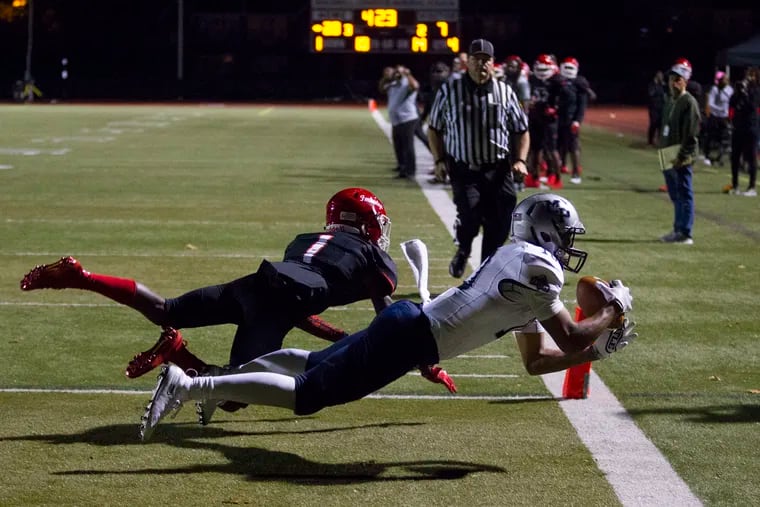 Lonnie White, Jr. of Malvern Prep, shown here making a diving touchdown catch last season vs. Imhotep Charter, and the rest of the Friars will return to competition as the school on Friday announced plans to stage fall sports as an independent.
