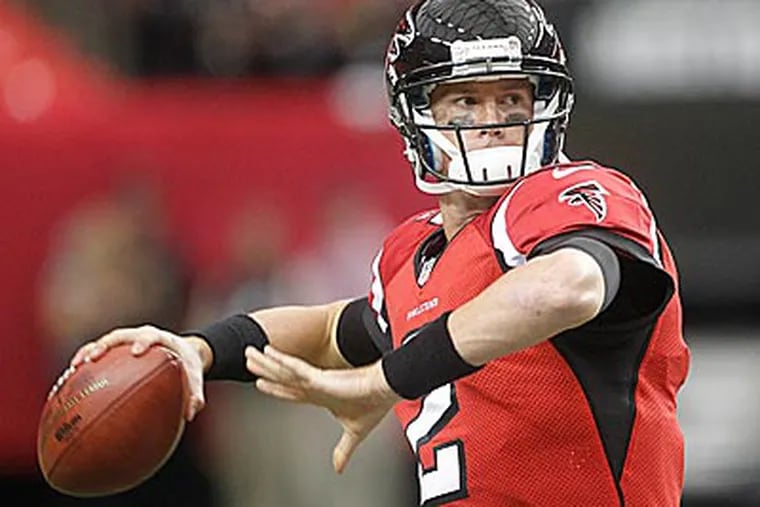 Falcons quarterback Matt Ryan (2) works before before the first half of a game against the Oakland Raiders. (John Bazemore/AP)
