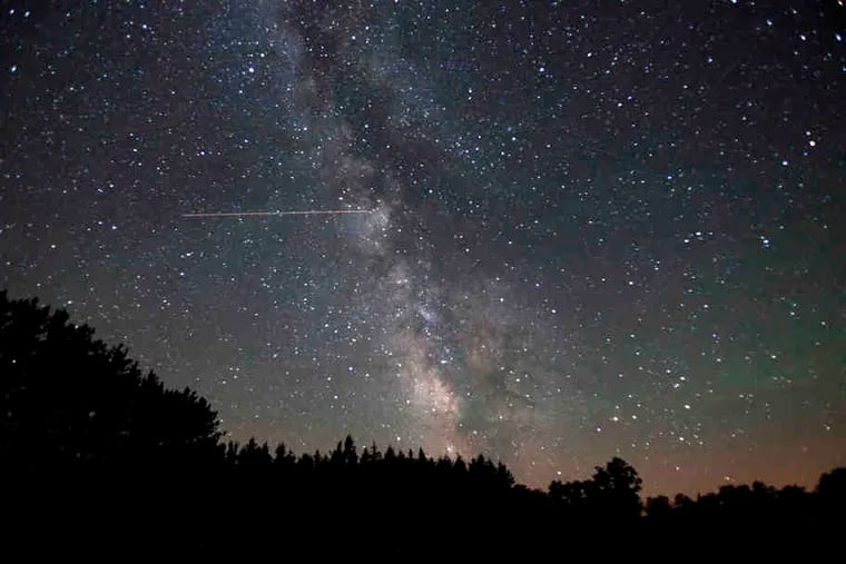 The Milky Way is a dramatic presence at Cherry Springs State Park, with a jet crossing this view. The International Dark-Sky Association certifies the park as an "international dark sky park."