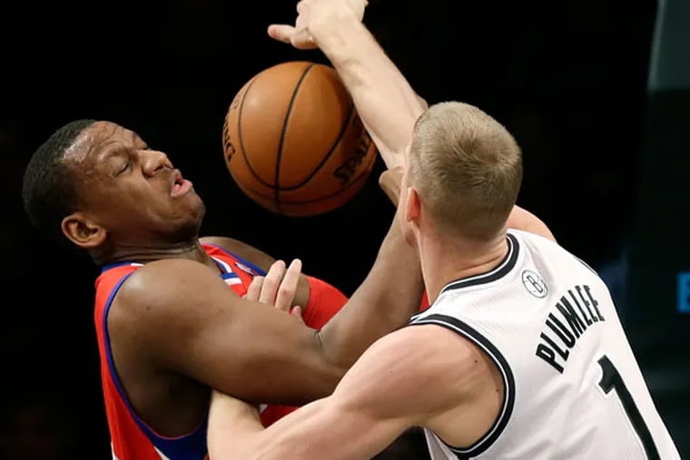 Lavoy Allen, left, and Brooklyn Nets' Mason Plumlee fight for a rebound during the first half of an NBA basketball game at the Barclays Center, Monday, Dec. 16, 2013, in New York. (Seth Wenig/AP)