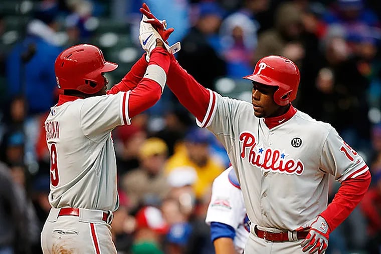 Phillies outfielders John Mayberry Jr., right, and Domonic Brown. (AP Photo/Andrew A. Nelles)