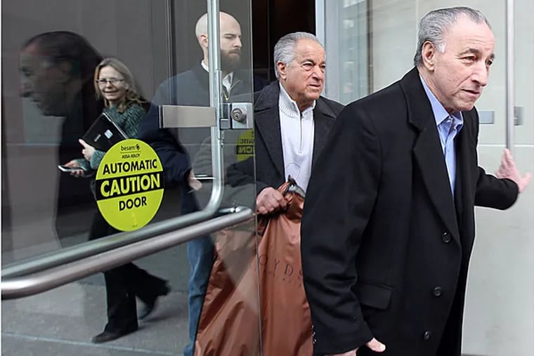 Joseph Ligambi, left, walks out of the Federal Courthouse with his brother, Phil, center, on January 28, 2014. ( DAVID MAIALETTI / Staff Photographer )