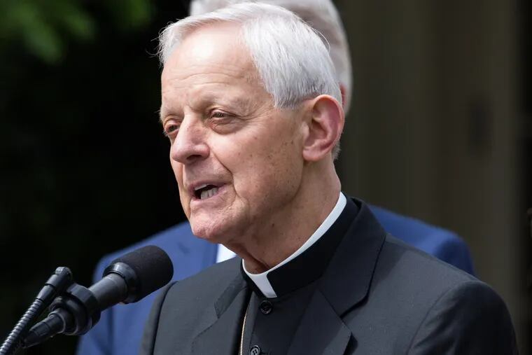 Cardinal Donald Wuerl praying at White House ceremony last year.  His name has been removed from a Pittsburgh area high school after he was cited in grand jury's clergy-abuse report. (Cheriss May/Sipa USA/TNS)